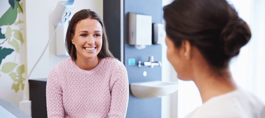 A student speaking with a doctor